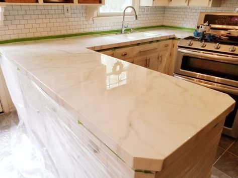 I gave my shabby counters a beautiful realistic faux marble update. My counters were looking very worn and were a real eyesore. We are planning a complete remodel.of the kitchen but not for 2 years. I decided I needed a budget friendly update. I found a faux marble countertop kit by Giani on Amazon. I was ready for a budget friendly update. I taped off the backsplash and sink and sanded a few rough spots to prep for paint. I used a foam roller to roll on several coats of the wh… Marble Painted Countertops, Countertop Update, Blue Canister Set, Diy Plate Rack, Faux Marble Countertop, Countertop Kit, Concrete Stool, Reclaimed Brick, Built In Bar