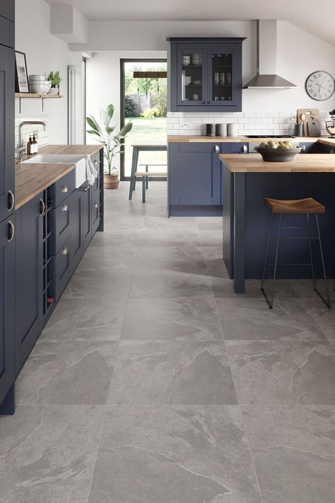 Navy blue kitchen with natural wood  tops and stone floor tiles Grey Marble Floor Kitchen, Kitchen With Tiled Floor, Kitchen Ideas Floor, Grey Kitchen Floor Tiles, Grey Marble Floor, Marble Floor Kitchen, Direct Wood Flooring, Grey Kitchen Floor, Orchard House