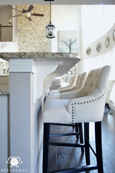 Linen Lydia Bar Stools at Bar in White Kitchen White Stools Kitchen Island, White Bar Stools Kitchen, White Kitchen Bar Stool Ideas, Comfortable Bar Stools Kitchen Island, Kitchen Counter Stools With Backs, Kitchen With Cream Cabinets, Kitchen Stools For Island, Doorway Ideas, Rustic Counter Stools