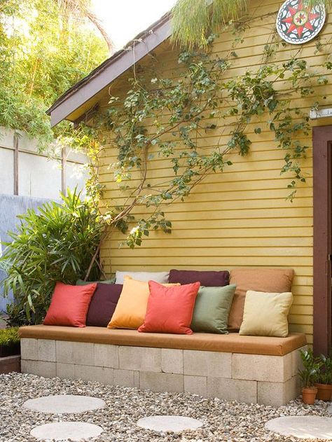 Update your backyard and landscaping with our cheap, budget-friendly ideas for adding simple decor and a few DIY projects to really up the charm in your yard. From a DIY bench to adding a vertical garden along your garage or shed, these simple and easy backyard ideas will transform your yard from dull to charming. Garden Remodel, Future Garden, Yellow House, Side Garden, Cinder Block, Outside Living, 15 Diy, Budget Backyard, Outdoor Bench