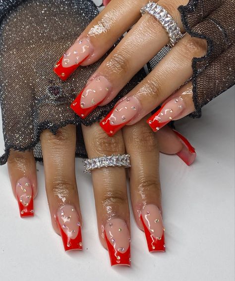 Red Tie Nails, Short Acrylic Red Nails Designs, Short Red Nail Designs Classy, Red Birthday Nails Acrylic Medium, Red Gemstone Nails, Red Nails With Jewels, Red Acrylic Nails With Charms, Red French Tip Nails With Gems, Red Outline Nails