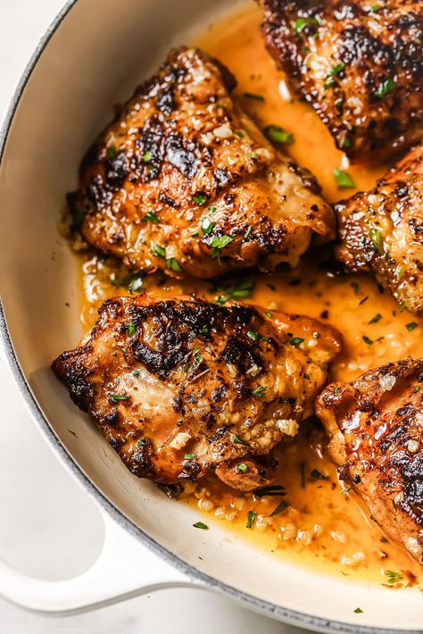 Close up of pan seared chicken thighs in a skillet. Chicken Thigh Recipes Bone In, One Pan Chicken Thighs, Stove Top Chicken Thighs, Pan Fried Chicken Thighs, Chicken Thigh Recipes Stovetop, Bone In Chicken Thigh Recipes, Pan Seared Chicken Thighs, Chicken Thigh Marinade, Easy Roasted Potatoes