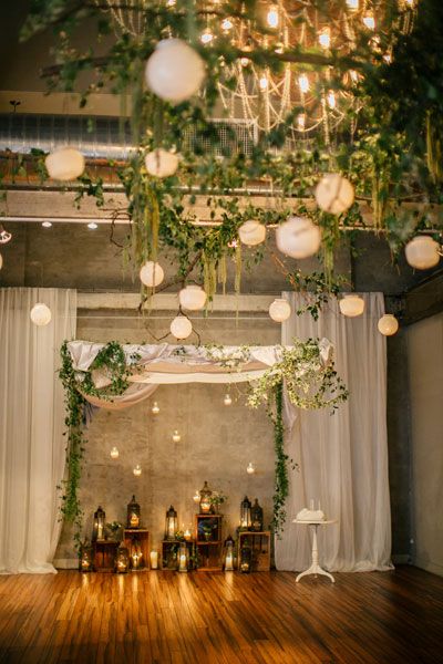 Vines, branches, and candles suspend from the ceiling’s beams to create a “floating” chuppah. The result is a bewitching, whimsical atmosphere that beautifully juxtaposes with an edgy urban industrial setting. Industrial Wedding Ceremony, Winter Wedding Arch, Hanging Wedding Decorations, Greenery Wedding Decor, Industrial Wedding Venues, Deco Champetre, Wedding Ceremony Arch, Fall Wedding Colors, Mod Wedding