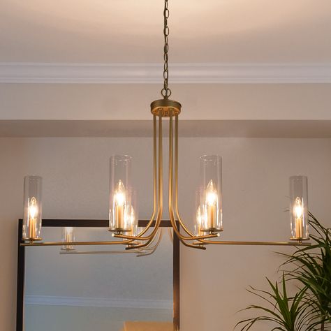 A classic fixture for your modern decor, this 6-light gold chandelier elegantly illuminates your living room, dining room, and bedroom. Modern Gold Chandelier, Dinning Room Lighting, Modern Dining Room Lighting, Gold Light Fixture, Chandelier For Dining Room, Dining Chandelier, Unique Chandeliers, Dining Room Light Fixtures, Dining Lighting