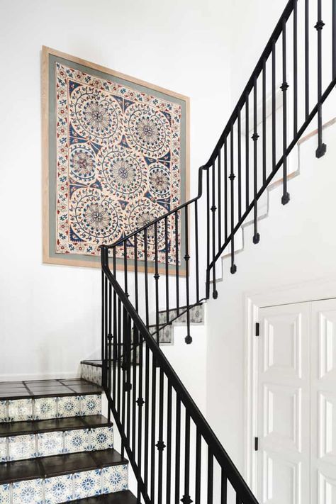 This Spanish Style Home in West Palm Beach Gets a Beautiful Makeover 1920s Spanish Home, Hacienda Mansion, Stair Redo, Stairway Chandelier, Spanish Inspired Home, Wood Railings For Stairs, Simple Gallery Wall, Modern Hacienda, Garage Apartment Ideas