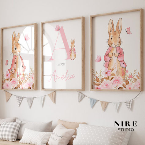 🐰 RABBIT WALL ART 🐰 Introduce the delightful realm of Peter Rabbit to your nursery! This personalised pink wall art adds whimsy and warmth, crafting a snug haven for your baby girl. With an endearing illustration starring Flopsy Rabbit and your little one's initial and birth date, it's a charming touch for their space. Bunny Nursery Decor, Nursery Floral, Bunny Wall Art, Peter Rabbit Nursery, Rabbit Wall Art, Rabbit Nursery, Pink Nursery Decor, Bunny Nursery