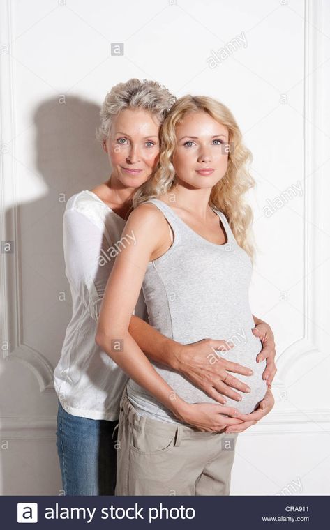 Download this stock image: Woman holding pregnant daughters belly - CRA911 from Alamy's library of millions of high resolution stock photos, illustrations and vectors. Mother Daughter Fashion, Stock Photos Woman, Teenage Daughters, Pregnant Belly, Photos Of Women, Scrambled Eggs, Maternity Pictures, Maternity Photography, Mother Daughter