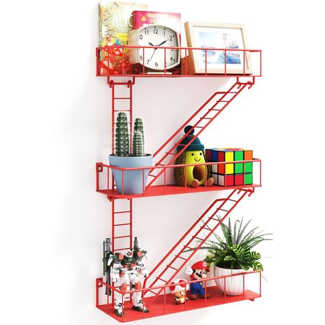 PRICES MAY VARY. UNIQUE STYLE: You can mount the mini escape wall ladder shelf on the wall of your home or office. The special shape of the shelf is very eye-catching. It will make your guests more impressed with the home decoration and emphasize your fashionable taste. The industrial wall shelves made of red metal is a great choice for you to decorate your wall. DIY INSTALLATION: You can try different installation methods, let your imagination run wild. The knick knack shelf can be neatly arran Funky Wall Shelf, Kallax Upcycle, Pastel Office Decor, Funky Shelves, Unique Bathroom Storage, Alaska Decor, Unique Storage Ideas, Fire Escape Shelf, Wall Shelves For Bathroom