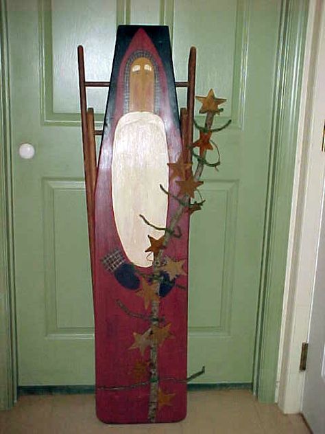 Painted on wooden ironing board--a little austere for me but like the added "xmas tree" Painted Ironing Board Ideas, Painted Wooden Ironing Boards, Ironing Board Angel, Ideas For Old Wooden Ironing Boards, Santa Painted On Wood Ironing Boards, Rustic Snowman On Ironing Board, Painted Ironing Board, Wood Ironing Boards, Wooden Ironing Board