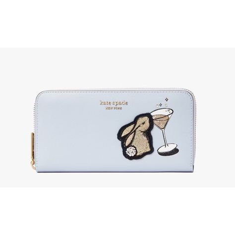 This Kate Spade New York Zip-Around Continental Wallet With A Delightful Bunny Character Is A Must-Have For Any Fashion-Forward Woman. The Light Blue Color And Faux Pearl Bunny Tail & Crystal Bubbles From A Martini Glass Accent Make This Wallet A Modern And Luxurious Accessory. It Is Made Of High-Quality Leather That Ensures Durability. With Eight Inches In Length And 1.25 Inches In Width, This Wallet Is Spacious Enough To Accommodate All Of Your Credit Cards And Features A Folding Design. Its B Bunny Character, Dream Gift, Bunny Tail, Large Wallet, Kate Spade Wallet, Birthday Wishlist, Distressed Black Jeans, Light Blue Color, Martini Glass