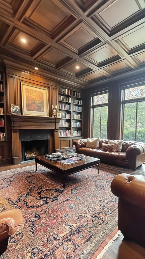 Cozy living room with dark wood paneling, leather sofas, ornate fireplace, and large windows overlooking the backyard. Atmosphere Picture, Cozy Earthy Living Room, Earthy Living Room Ideas, Dark Wood Paneling, Ornate Fireplace, Windows Frame, Rustic Comforter, Earthy Living Room, Home Transformation