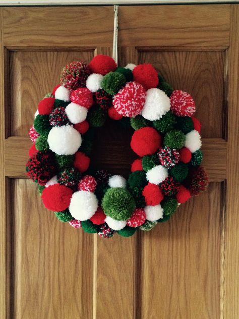 Pom Pom Christmas wreath made by me (JoMoore) 130 pom poms on a polystyrene ring. Christmas Pom Pom Crafts, Knitted Christmas Decorations, Knitting Christmas, Christmas Pom Pom, Eco Christmas, Pom Crafts, Pom Pom Wreath, Christmas Decorations Wreaths, Crochet Christmas Decorations