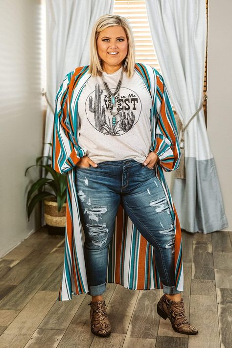 Throw on a wild west vibe with this duster-length cardigan, with earthy stripes accented by teal, that's the real deal! Balloon sleeves, 47" long. Taylor is wearing a size XL. She is 5' and wears as size 14 curvy plus jean and 14 plus size dress.åÊ PLUS SIZE CHART 14/16 (1X) 18/20 (2X) 22/24 (3X) BUST åÊ 39-41 42-44 44-46 WAIST 35-38 39-42 44-46 HIPS 41-45 46-50 52-54 Plus Size Western Outfits Woman, Plus Size Western Outfits, Plus Size Western Fashion, Plus Size Western Wear, Plus Size Western, Plus Size Cardigan, Western Style Outfits, Rodeo Outfits, Western Outfits Women