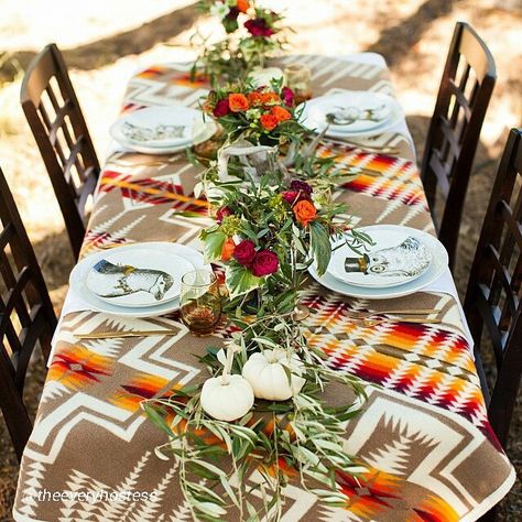 An interesting use of a Pendleton Chief Joseph wool blanket. You can find Pendleton blankets at Sheepskin of Oregon in downtown Portland Oregon, or at www.sheepskinoforegon.com Fall Harvest Dinner, Harvest Dinner Party, Navajo Wedding, Harvest Dinner, Native American Wedding, Pendleton Woolen Mills, Lodge Decor, Harvest Festival, Western Decor