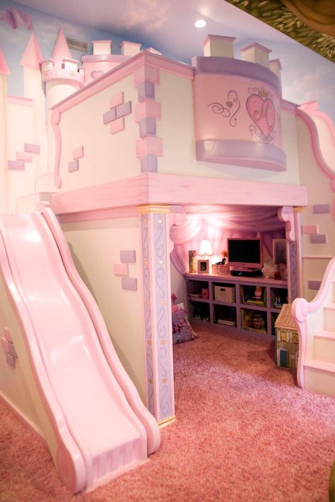 This playful pink bedroom is any little princess's dream. The custom castle features a cozy loft bed nestled within fortress walls and a slide down to the princess play area. Castle Bedroom Kids, Princess Castle Bed, Bilik Tidur Perempuan, Bilik Perempuan, Bilik Tidur Mewah, Bed For Girls Room, Girls Bedroom Sets, Princess Bedrooms, Castle Bed