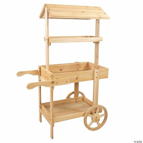 This lovely wheeled garden planter has the appearance of an old-fashioned market stall. It features a sturdy garden flower cart that makes it easy to access ... Small Produce Stand, Flower Stand Ideas Outdoor, Botanica Shop, Market Cart, Garden Community, Firewood Racks, Country Market, Flower Farming, Dorm Storage