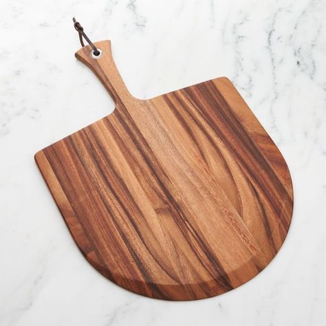 Transport your pizza to and from the oven safely with our heavy-duty acacia wood pizza peel, large enough to accommodate any size pie. Pizza paddle's hardwood handle features a hanging loop for easy storage.Check out our guide for making perfect pizza at home.  • Acacia wood • Apply wood oil as needed • Hand wash; do not soak • Made in Thailand Outdoor Pizza Oven Kits, Pizza Oven Kits, Pizza Paddle, Pizza Tools, Wood Pizza, Registry Items, Perfect Pizza, Pizza Peel, Crate Barrel