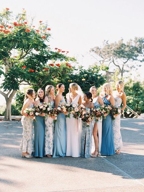 Looking for blue bridesmaid ideas? Look no further than this seaside wedding in shades of blue and pink! Blue Bridesmaid Dresses Mismatched With Groomsmen, Pink And Blue Bridesmaid Dresses, Shades Of Pink Bridesmaids, Shades Of Blue Bridesmaid Dresses, Mismatched Bridesmaid Dresses Blue, Bridal Party Color Schemes, Wedding Pallet, Scripps Seaside Forum, Summer Weddings Bridesmaids