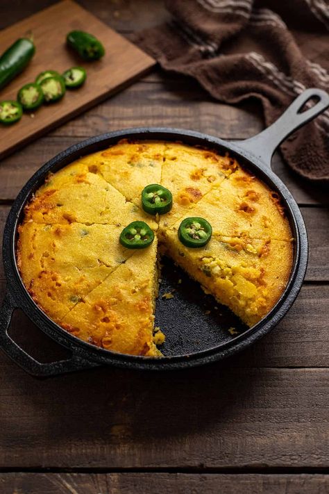 Easy, cheesy Mexican cornbread made with sour cream, jalapenos, cheddar cheese, cream corn, and corn meal (no Jiffy!). Super moist!  No matter what you call it, Mexican Cornbread or Jalapeno Cheddar Cornbread, this 3-layered cornbread is the moistest, cheesiest, and tastiest jalapeno cornbread yet!ade Mexican cornbread made with cornmeal, sour cream, cheddar cheese, cream corn, and jalapenos. Super moist! No Jiffy! Cheesy Mexican Cornbread, Mexican Cornbread Jiffy, Cream Corn Bread, Easy Mexican Cornbread, Sour Cream Cornbread, Creamed Corn Cornbread, Mexican Cornbread Recipe, Jalapeno Cheddar Cornbread, Cornbread Recipes