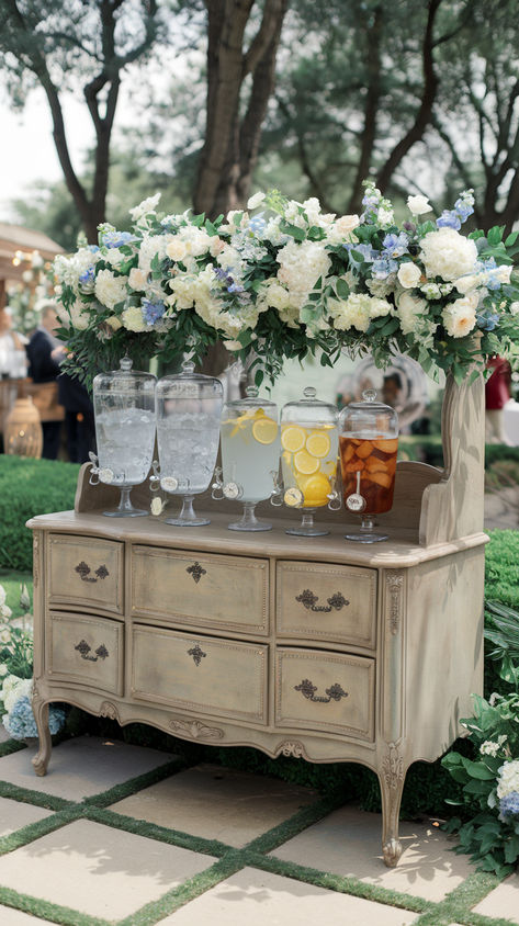 Hydrating drink station containers at an outdoor spring wedding Drink Table At Wedding, Ceremony Beverage Station, How To Serve Drinks At A Wedding, Diy Drink Station Wedding, Drink Trough Wedding, Wedding Garden Party Ideas, Fun Wedding Reception Ideas Food Stations, Wedding Cocktail Hour Indoor, Outdoor Bar Ideas For Party