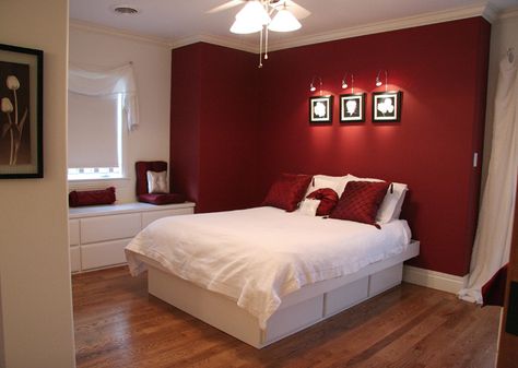 Trend: feature walls. Bold red wall in the guest room of a bedroom addition. Remodeling and addition by Martin Bros. Contracting, Inc. Red Accent Wall Bedroom, Maroon Bedroom, Bedroom Painting Ideas, Red Bedroom Walls, Maroon Walls, Red Bedroom Design, Red Bedroom Decor, Feature Wall Bedroom, Bedroom Painting