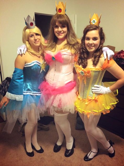 Peach, Daisy, and Rosalina cosplay Princess Peach Daisy And Rosalina Halloween Costume, Rosalina Costume Mario, Peach Daisy And Rosalina Costume, Hot Trio Costume Ideas, Rosalina Mario Costume, Rosalina Costume, Peach Daisy And Rosalina, Daisy And Rosalina, Rosalina Cosplay