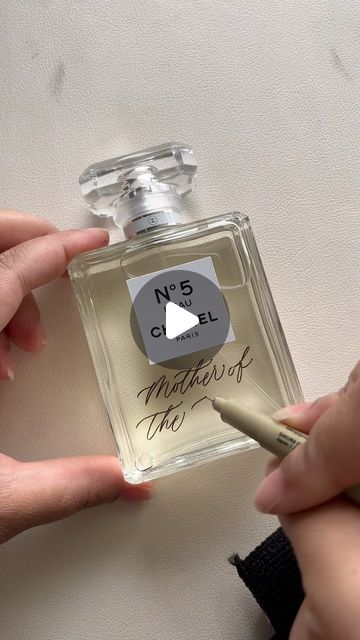 Taylor // Tulsa Calligrapher & Engraver on Instagram: "engraved Chanel No. 5 for the Mother of the Bride ✨✍🏽🤍 I loveee the engraved date along the side of this bottle 🥹 I always send my clients mock ups to approve before I do any engraving because 1. engraving is permanent and 2. I want to make sure they will 100% love how it turns out. Depending on the bottle and the amount of open space, I will sometimes give a couple of different layout options to choose from. For this perfume, this is the final design that my client chose and I am in love with how it turned out! If you’re interested in getting an engraved keepsake for your loved ones this year before the holidays, please dm or email me soon! And as always, if you think of any questions, feel free to reach out 😇🤍🎄 #chanelno5 #chan Mother Of The Bride Gifts, Chanel No5, Chanel No 5, Chanel Perfume, Green Wedding Shoes, Mock Ups, No 5, Bridal Gifts, Bride Gifts