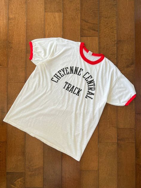 Vintage Vintage Russell Ringer Tee Cheyenne Central Track [XL, 70s] | Grailed 70s Ringer Tee, Ringer Tee Vintage, Tee Designs, Men's Tops, Ringer Tee, Russell Athletic, Tee Design, Vintage Tops, Vintage Tshirts