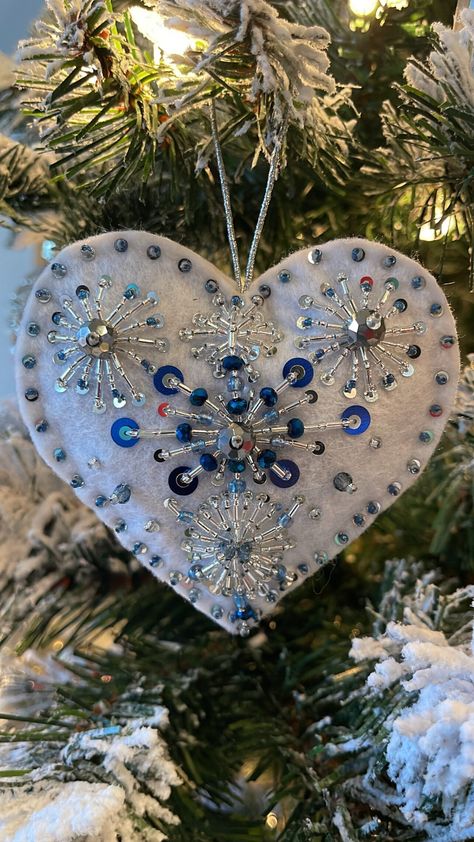 Introducing our exquisite handcrafted heart ornament, a little piece of art that's made with love, care, and attention to detail. Every stitch is carefully placed, every glass bead and sequin is meticulously chosen, resulting in a truly unique and delicate piece that will make the perfect gift for someone special. Crafted from quality felt and adorned with beautiful glass beads and sequins, this heart ornament will be treasured for years to come. Whether you want to give it as a gift or keep it Beaded Tree Ornament, Frozen Tree, Christmas Felt Ornaments, Sequin Ornaments, Blue Christmas Ornaments, Christmas Decoration Items, Heart Christmas Ornaments, Heart Christmas, Christmas Blue