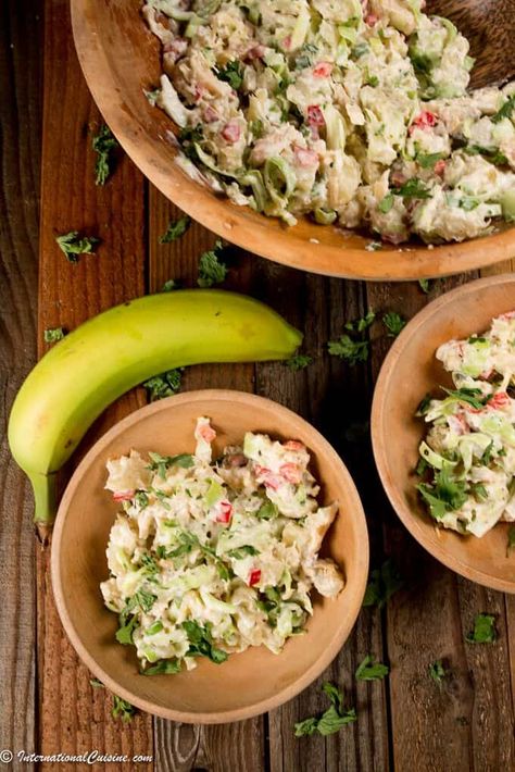 Green fig and salt fish salad is a lovely dish that is famous in the Caribbean Islands in the lesser Antilles. Green figs are actually green bananas and a major agricultural crop for the islands. You should try it! #caribbeanfood #greenfig #saltfish #saladrecipe #saltedfishrecipe #greenfigsrecipe #caribbeancuisine #caibbeanfood Green Fig Salad, Caribbean Octopus, Caribbean Meals, Salt Fish Recipe, Trini Recipes, Green Figs, Banana Salad, Salt Fish, Nigeria Food