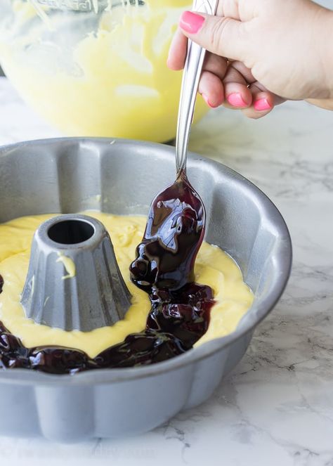 This Lemon Blueberry Surprise Cake is deliciously moist and filled with a surprise blueberry filling! It's so easy to make too! Festival Snacks, Blueberry Pie Filling Recipes, Lemon Cake Mix Recipe, Lemon Blueberry Bundt Cake, Blueberry Bundt Cake, Blueberry Pound Cake, Blueberry Filling, Lemon Pie Filling, Pie Filling Recipes