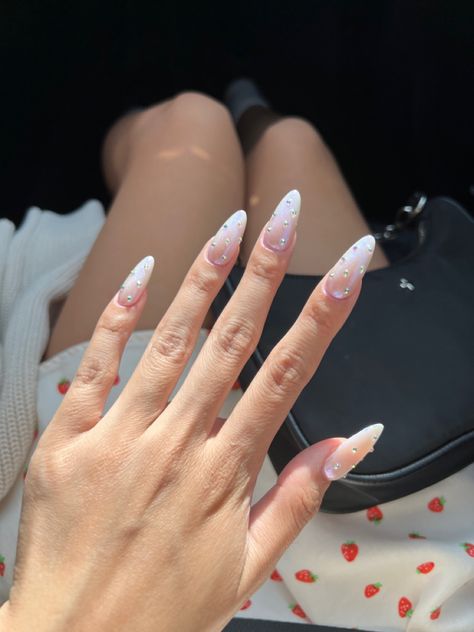 Hailey Bieber Nails Rhinestone, White And Glitter Nails Almond, Sparkly Almond Shape Nails, Chrome Sparkly Nails, White Chrome With Glitter, Hailey Bieber Nails With Gems, White French Tip Nails Almond With Rhinestones, Formal Nails Acrylic Almond, Milky White Almond Nails With Rhinestones