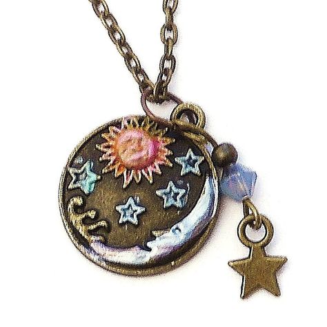 "A cute necklace to pop on when you want to add a little celestial style to your outfit! A little sun and moon pendant is accented with touches of violet and golden-pink and tiny stars are detailed in light turquoise blue! A Swarovski crystal bicone bead dangles at one side along with a little star charm, adding sparks of purple light! Just choose your favorite length and make it yours! Antiqued Gold-plated Charm 3/4\" round, Antiqued Gold-plated Necklace w/ Lobster Clasp 18\"-28\" MORE ARTFUL I Celestial Style, Stars Necklace, Bead Dangles, Star Pendant Necklace, Funky Jewelry, Saint James, Charm Pendant Necklace, Bleu Turquoise, Bohemian Hippie