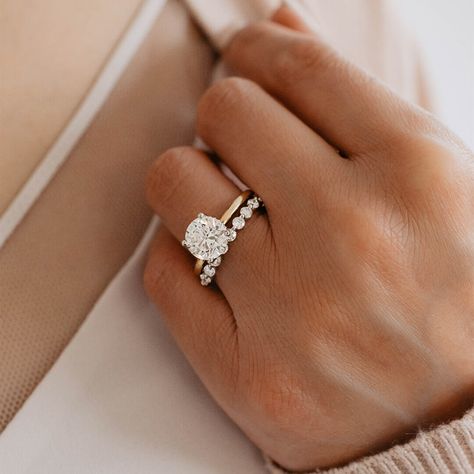 This stunning diamond wedding band features a shared prong setting with .50 carat total weight of diamonds set… Circle Engagement Rings, Solitaire Wedding Set, Gold Band Engagement Rings, Shared Prong Wedding Band, Pretty Engagement Rings, Pave Wedding Bands, Classic Engagement Ring Solitaire, Cute Engagement Rings, Round Solitaire Engagement Ring