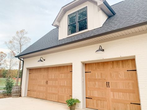 I really wanted the look of wood garage doors but didn’t want the maintenance (or cost!) I loved our C.H.I doors that are stamped to look like wood! We went with carriage house style in “Natural Oak”. White Garage Doors, Faux Wood Garage Door, Carriage House Garage Doors, White Garage, Wood Garage, Farmhouse Architecture, Wood Garage Doors, French Doors Exterior, Home Bunch