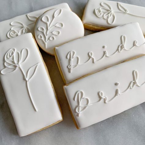 Kayla Block | A quick elegant shower set. Obsessing over the simplicity of white iced cookies. . . . #weddingcookieset #weddinginspiration… | Instagram White And Gold Bridal Shower Cookies, Untraditional Kitchen, Royal Iced Wedding Cookies, Simple Bridal Shower Cookies, White Royal Icing Cookies, Wedding Decorated Sugar Cookies, Bridal Shower Royal Icing Cookies, White Cookies Decorated, Wedding Shower Cookies Decorated