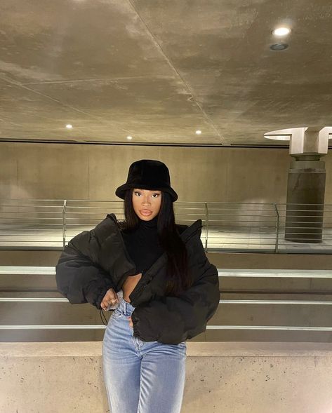 Bucket hat, black puffer jacket, makeup, baddie, gorgeous gal, denim Baddie Outfits With Puffer Jackets, Crop Black Puffer Jacket Outfit, Puffy Hat Outfit, Puffer Jacket Outfit Cropped, Short Black Puffer Jacket Outfit, Styling Black Puffer Jacket, Black Bucket Hat Outfit Winter, Denim Puffer Jacket Outfit, Black Jean Jacket Outfits Baddie