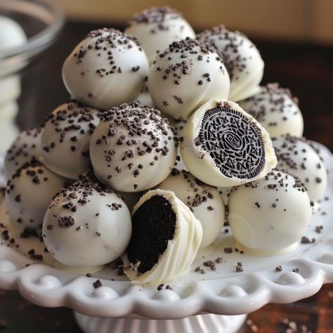 🍫 Indulge in these Easy Oreo Cake Balls! Quick, delicious, and perfect for any occasion. 😍✨ #OreoLovers #DessertGoals Easy Oreo Cake Balls Ingredients: Oreo cookies, crushed (36) Cream cheese, softened (8 oz) White chocolate, melted (16 oz) Instructions: Mix crushed Oreos and cream cheese until well combined. Roll mixture into small balls. Dip balls in melted white chocolate, place on wax paper. Chill until firm. Enjoy these delectable treats that are sure to be a hit! 🍫✨ #RecipeInspire #... Oreos And Cream Cheese, Easy Oreo Cake, Oreo Cake Balls, Melted White Chocolate, Instagram Recipes, Twisted Recipes, Crushed Oreos, Oreo Cake, Trending Recipes