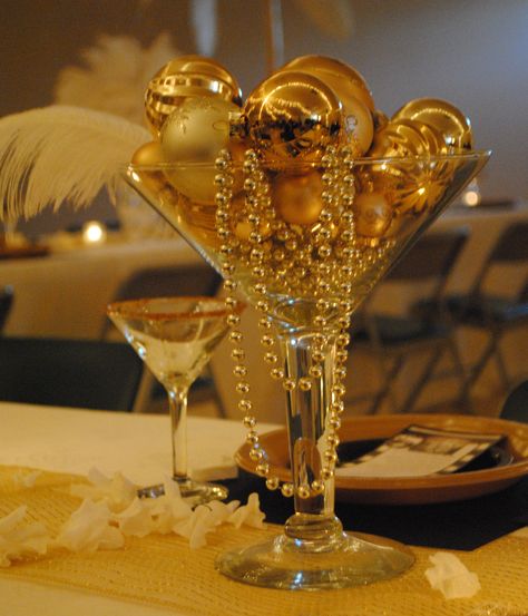 Martini glass centerpiece Hollywood Party Centerpiece Ideas, Boujee Centerpieces, Golden Gala Homecoming Theme, Great Gatsby Table Centerpieces, Met Gala Centerpieces, Roaring 20s Table Centerpieces, Golden Age Birthday Party Ideas, Martini Centerpiece Ideas, Great Gatsby Party Centerpieces