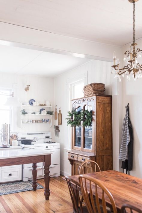 farmhouse kitchen table with antique brass chandelier. Victorian farmhouse kitchen in the background Victorian Farmhouse Kitchen, Farmhouse On Boone, Refinish Wood Floors, Farmhouse Kitchen Tables, Victorian Farmhouse, Farmhouse Kitchen Design, Farmhouse Interior, Farmhouse Furniture, Farmhouse Living