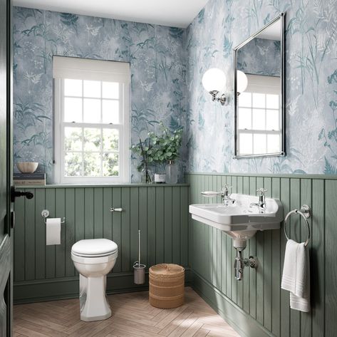 The use of traditional bathroom ceramics and accessories tie in beautifully with this classic, nature inspired wallpaper. A green accent adds to the calming nature of this cloakroom design. Wood Panel Bathroom, Transitional Bathroom Design, Burlington Bathroom, Small Downstairs Toilet, Toilet Room Decor, Bathroom Paneling, Traditional Bathroom Designs, Small Toilet Room, Bathroom Wall Panels