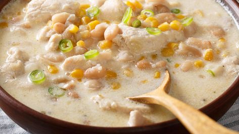 Crockpot White Chicken Chili (Made With Rotisserie Chicken as a Shortcut) | Recipe - Rachael Ray Show White Chicken Chili Recipe Crockpot, White Chicken Chili Healthy, Delicious Chili Recipe, White Chicken Chili Slow Cooker, White Chicken Chili Recipe, Chicken Chili Crockpot, White Bean Chicken Chili, Crockpot White Chicken Chili, Creamy White Chicken Chili