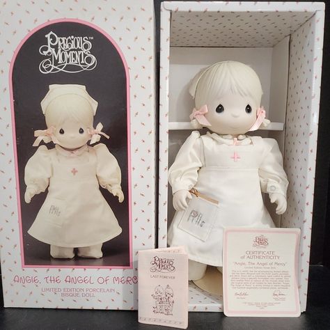 When I Opened This Box With This Nurse Doll For The First Time, I Was So Impressed With The Beauty And Quality Of This Doll. She Is So Beautiful And Beautifully Made. This Doll Had Never Been Out Of The Box Before. She Was Still Attached To The Backboard, And She's In Mint Condition! All The Papers And Coa Are Included. The Box Is In Great Condition Also. Perfect To Give To The Nurse In Your Life. She Is A Retired, Precious Moment, Collectible Doll. "Angie, The Angel Of Mercy Nurse Doll" 1987. L Precious Moments Lamb, Precious Moments Plush, Doll Collection Room, Angel Of Mercy, Doll Base, Blessed Mother Statue, Precious Moments Dolls, Doll Angel, Living Dead Dolls