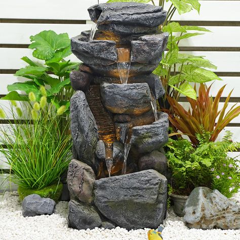 PRICES MAY VARY. 【The Beauty of Nature】This is a nature-inspired cascade garden water fountain outdoor. The stacked stone waterfall Fountain is so realistic looking, there's enough moss on each tier. 【Long Lasting Usage Rock outdoor fountains】The stone-liking garden waterfall was made from resin, with a natural look and realistic stone texture, it is rust and weatherproof, making the rockery waterfall look brand new over time. 【Efficient Size】Rock stacked structure measures 13.78" x 9.84" x 31.5 Indoor Rainforest, Rock Water Fountain, House Elevations, Fountain Outdoor, Garden Water Fountains, Waterfall Fountain, Water Fountains Outdoor, Fountain Pump, Outdoor Fountain