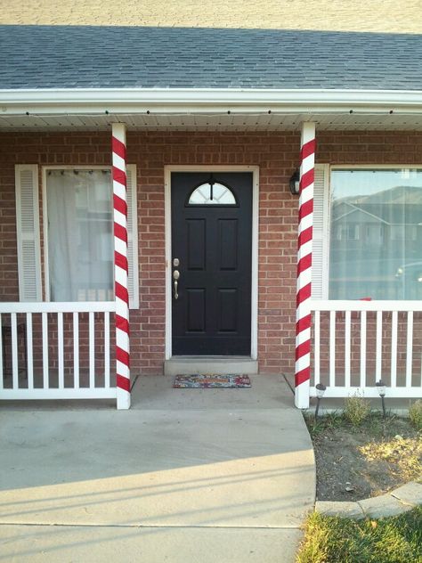 Candy cane front porch pillars Candy Cane Porch Pillars, Christmas Porch Pillar Decor, Candy Cane Front Porch Decor, Porch Pillar Christmas Decor, Christmas Decor Candy Cane, Decor With Lanterns, Front Porch Pillars, Pillar Decor, Cane Decorations