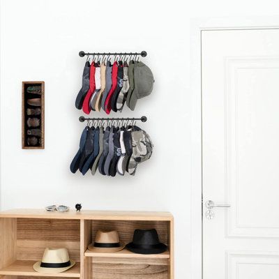 This hat organizer for wall comes with 20 rust-resistant "S" hooks, which can hold 20 caps. Best for snapback caps, visors or hats with straps. Addictional provide 10 "A" clips to meet all types of hats storage needs. This hat organizer for wall will not only storage all your baseball caps, hats, visors, snapback caps, make hats organized and easy access. You can also use it as scarfs, coats, belts, purse hooks rack in your room, but also a bathroom organizer to hang your towels, or in your entryway for bags and keys Latitude Run® | Latitude Run® Hat Rack For Wall Baseball Cap Organizer Hanger w/ 20 Hooks, Set Of 2, Black, Metal | C112101741 | Wayfair Canada Ball Cap Storage, Cap Wall, Cap Rack, Scarf Storage, Cap Organizer, Modern Hat, Wall Hats, Cap Display, Hanging Hats