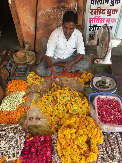 Flower vendor selling flowers to be purchased by temple goers who offer wreaths of flowers to the the Gods and Goddesses Flower Vendor, Selling Flowers, Jaipur India, Gods And Goddesses, Jaipur, Temple, India, Flowers, Quick Saves