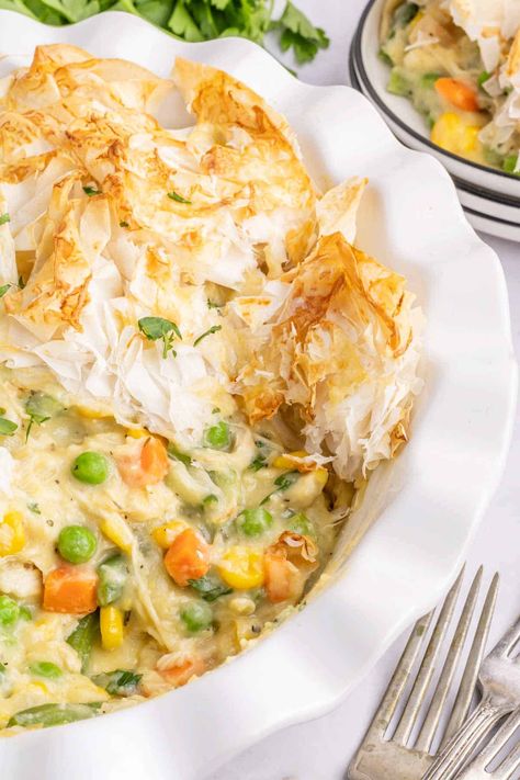 Chicken Pot Pie with Phyllo Dough is a hearty dinner recipe using shredded rotisserie chicken, frozen mixed vegetables, cream of chicken soup and sheets of phyllo dough. Pot Pie With Phyllo Dough, Philo Recipes, Chicken Pot Pie With Phyllo, Frozen Mixed Vegetables, Easy Chicken Pot Pie Recipe, Shredded Rotisserie Chicken, Recipes Using Rotisserie Chicken, Pot Pie Casserole, Mini Chicken Pot Pies