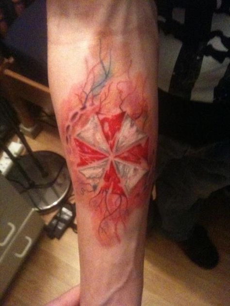 Umbrella Corporation symbol inside a zombie bite. Evil Arm Tattoo, Zombie Bite Tattoo, Nemesis Tattoo, Bite Tattoo, Resident Evil Tattoo, Zombie Bite, Umbrella Tattoo, Evil Tattoo, Inner Forearm Tattoo