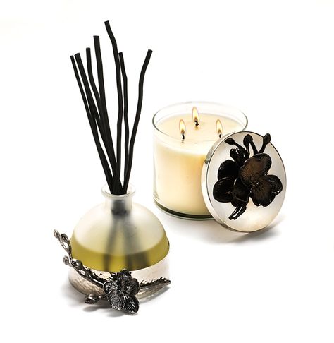 Michael Aram Black Orchid Diffuser and Candle - Black Orchid was inspired by the rich ambiance of evening and haute couture…gothic and feline…velvety, sensual and intoxicating. The essential elements in the base notes are deep cedar and sandalwood accented with warm musk. The intense middle essence is built on florals and tropical fruits while the top notes are made lithe with sheer citrus. Michael Aram Black Orchid, Star Gifts, Nice Holiday, Holiday Wishlist, Popular Perfumes, Fragrance Ingredients, Michael Aram, Decorative Table, Natural Perfume